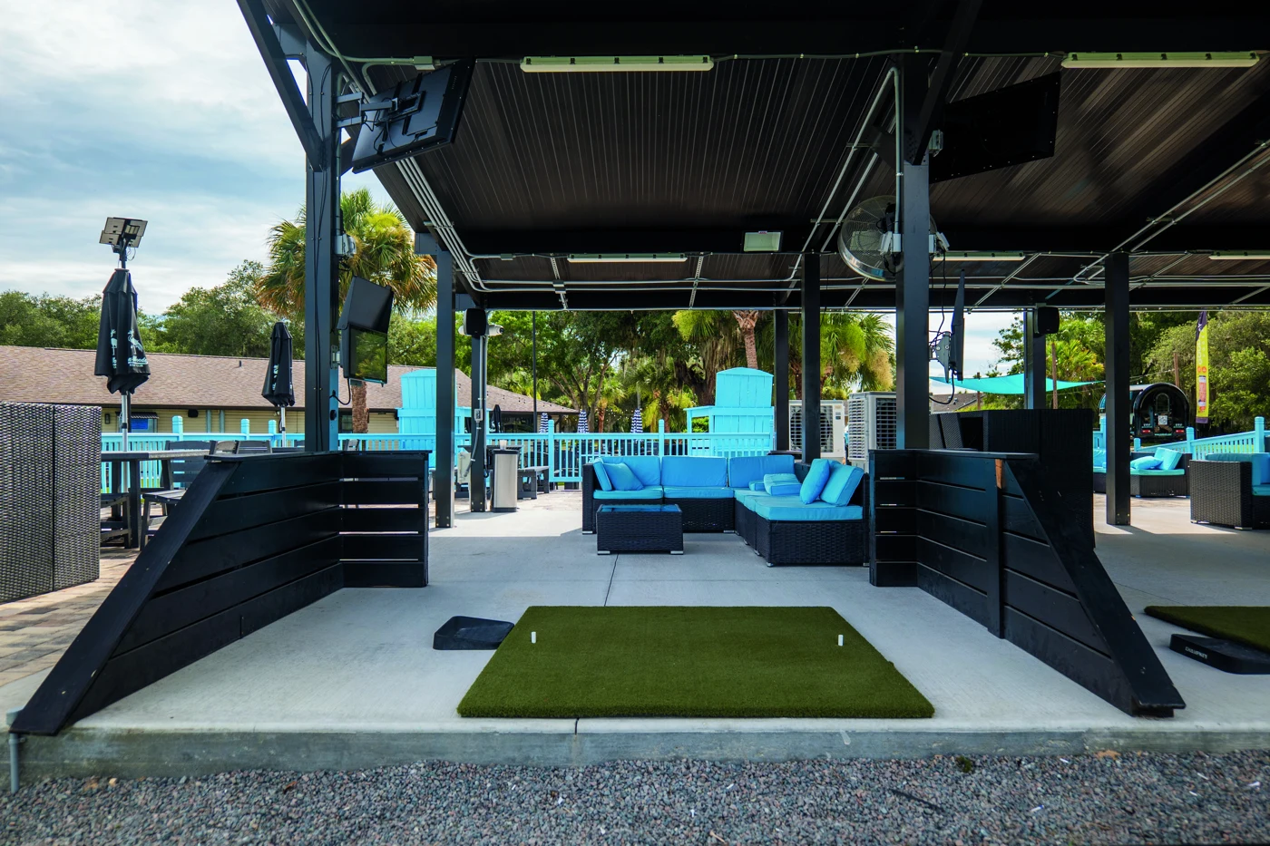 The ZenWoods VIP hitting bay with turquoise seating and space to gather